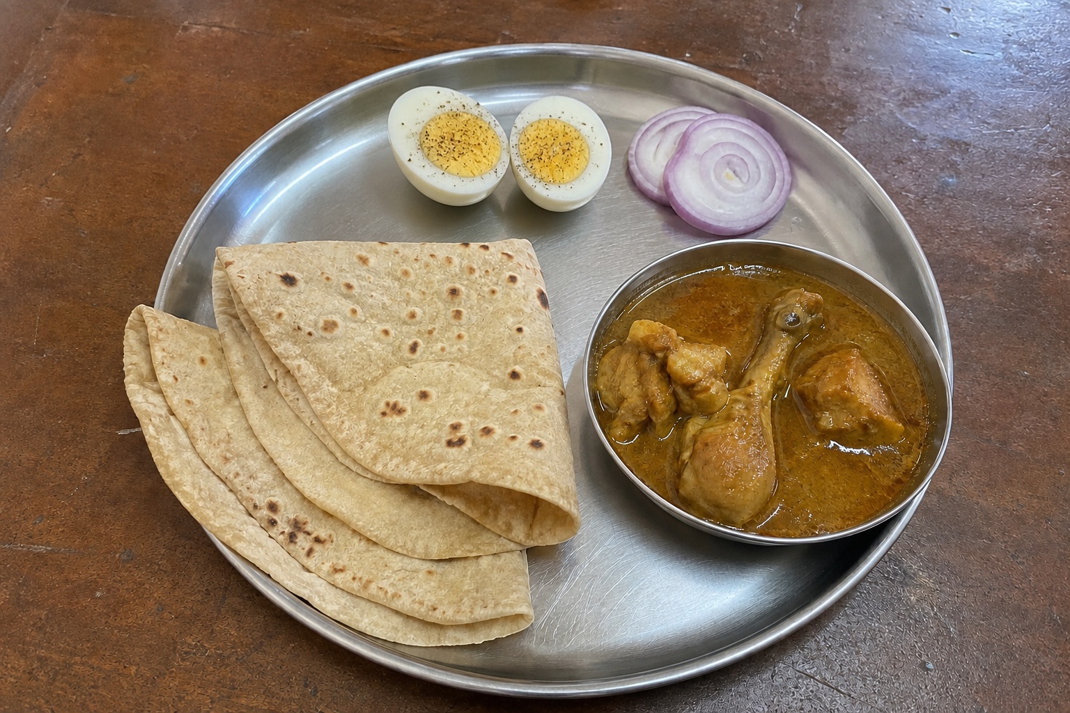 Chapatis, chicken saaru and boiled egg