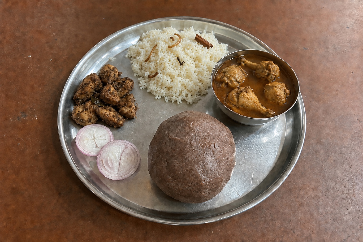 Ragi mudde, ghee rice, four-piece chicken saaru and chicken pepper fry